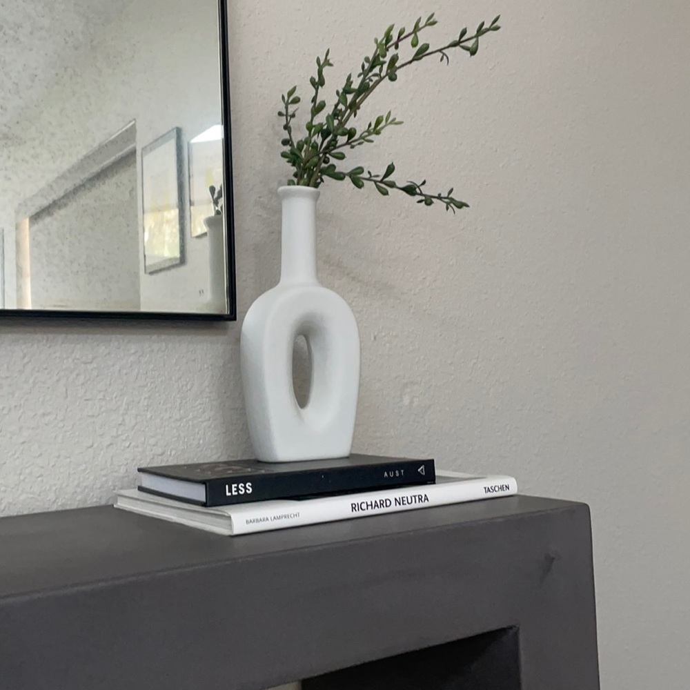 Matte white vase with faux plant